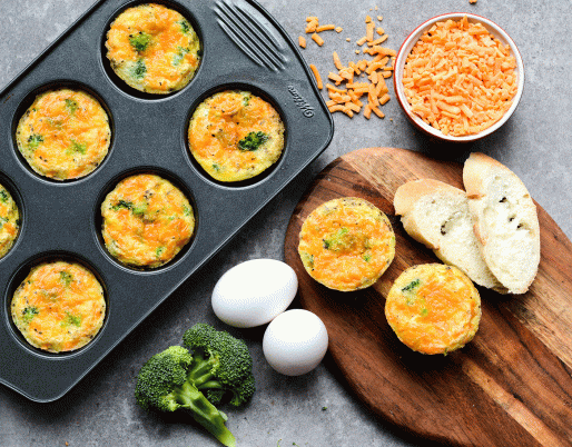egg muffins in a muffin tray with cheese and bread